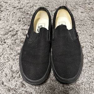 All black slip on Vans